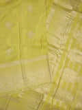 Dola tissue fancy saree lemon yellow color allover zari motifs & zari border with rich pallu and plain self blouse