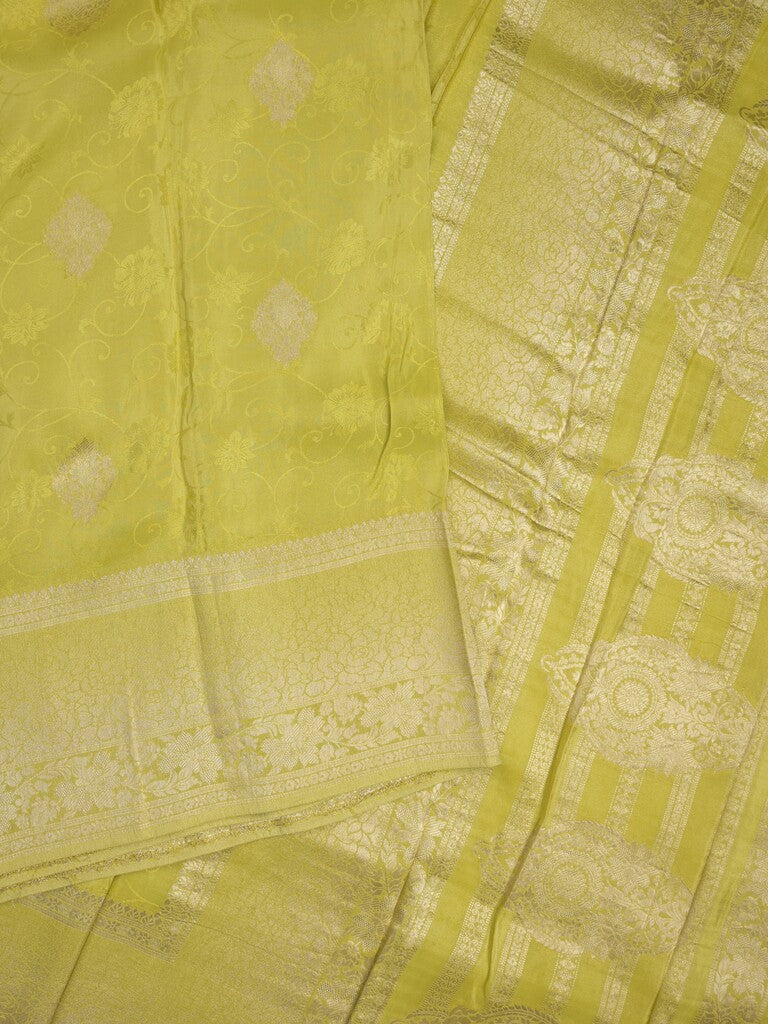 Dola tissue fancy saree lemon yellow color allover zari motifs & zari border with rich pallu and plain self blouse