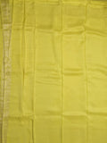 Dola tissue fancy saree lemon yellow color allover zari motifs & zari border with rich pallu and plain self blouse
