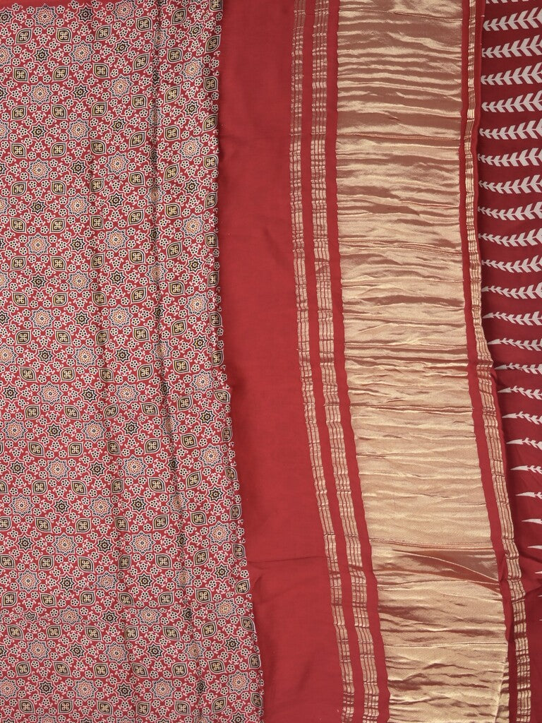 Modal silk fancy saree red color allover prints & small kaddi border with zari pallu and printed blouse