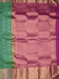 Kanchi pattu saree peacock green color allover zari motifs & kanchi border with rich pallu and contrast plain blouse