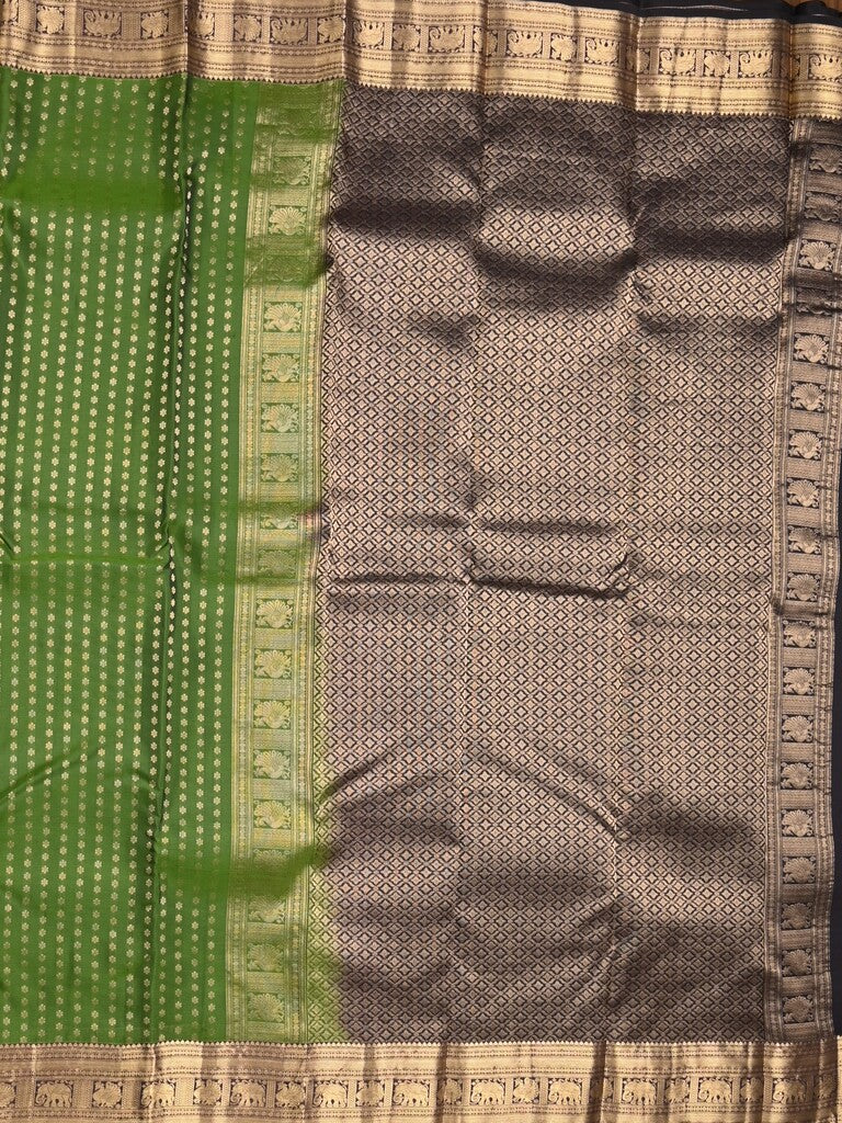 Kanchi pattu saree bottle green color allover zari motifs & zari border with rich pallu and contrast plain blouse