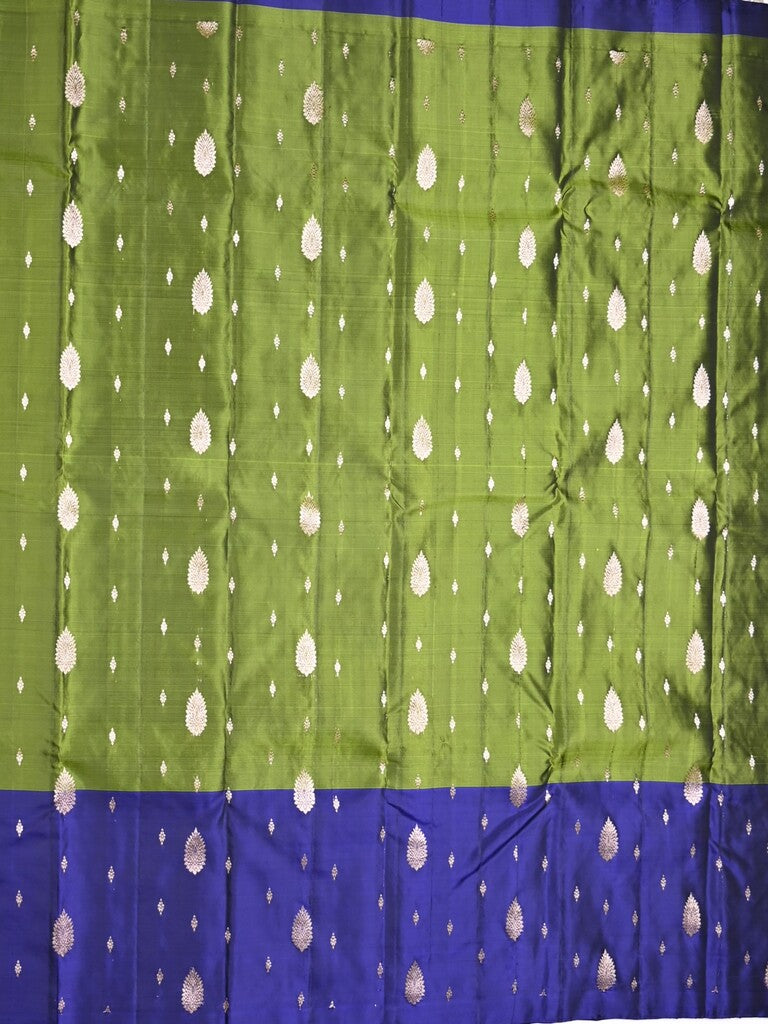 Kanchi pattu saree parrot green color allover zari motifs & zari border with rich pallu and contrast plain blouse