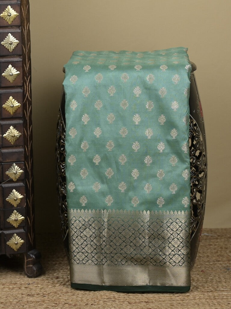 Dupion fancy saree in lux green color allover zari motifs & zari border with zari pallu and contrast blouse
