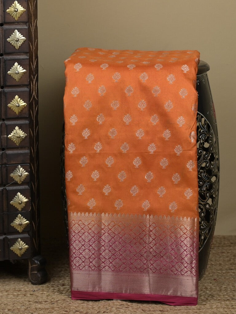 Dupion fancy saree in orange color allover zari motifs & zari border with zari pallu and contrast blouse