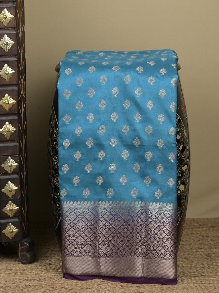 Dupion fancy saree in blue color allover zari motifs & zari border with zari pallu and contrast blouse