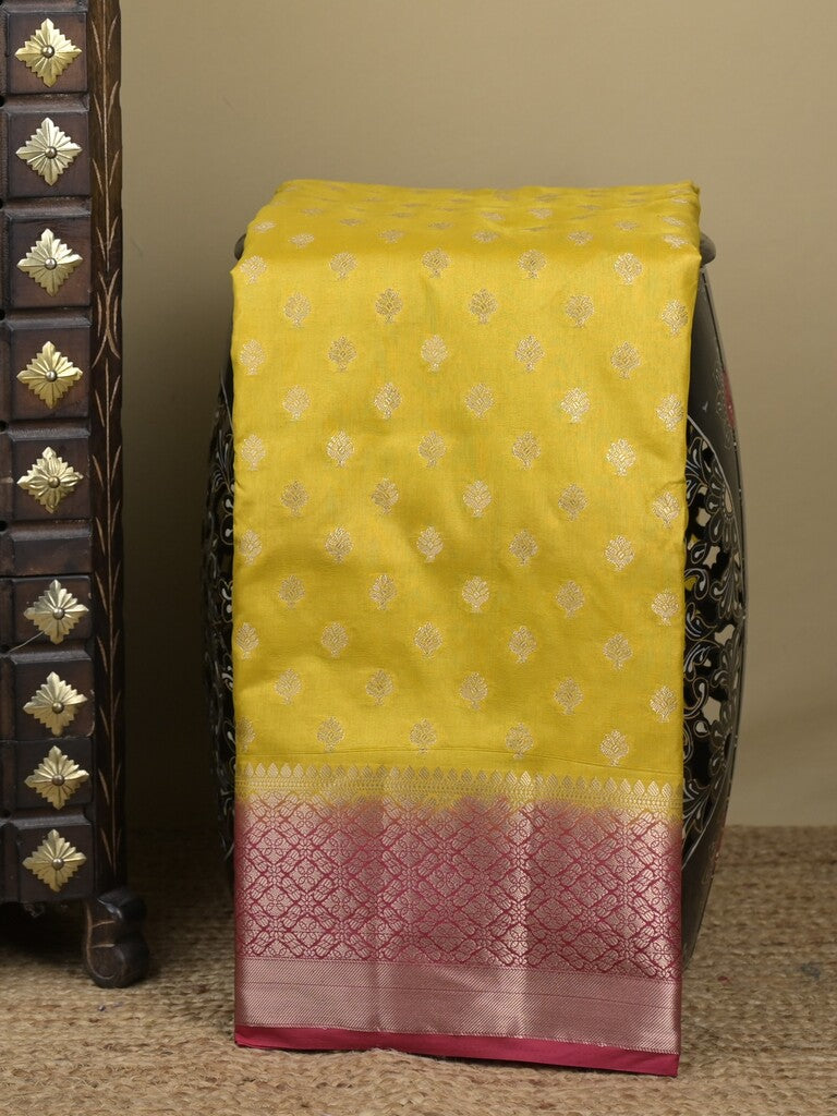 Dupion fancy saree in lemon yellow color allover zari motifs & zari border with zari pallu and contrast blouse