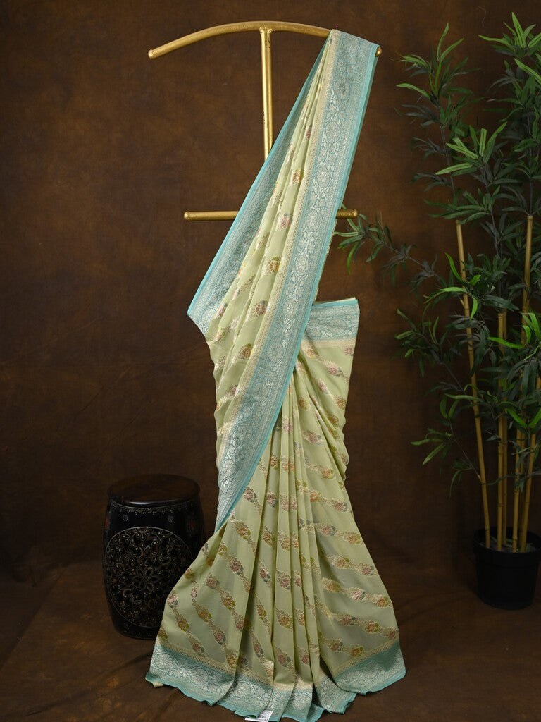 Pure georgette fancy saree pastel yellow color allover zari motifs & zari border with rich pallu and plain blouse