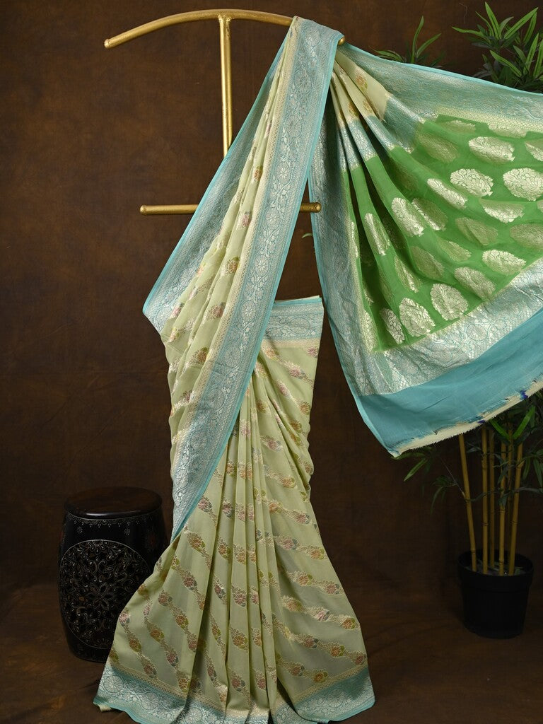 Pure georgette fancy saree pastel yellow color allover zari motifs & zari border with rich pallu and plain blouse