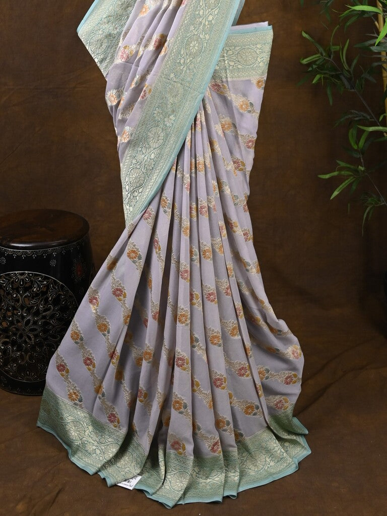 Pure georgette fancy saree pastel purple color allover zari motifs & zari border with rich pallu and plain blouse
