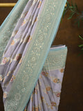 Pure georgette fancy saree pastel purple color allover zari motifs & zari border with rich pallu and plain blouse