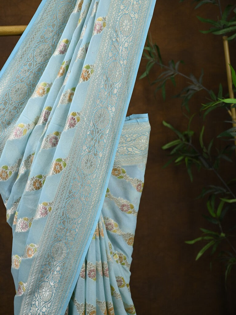 Pure georgette fancy saree light blue color allover zari motifs & zari border with rich pallu and plain blouse