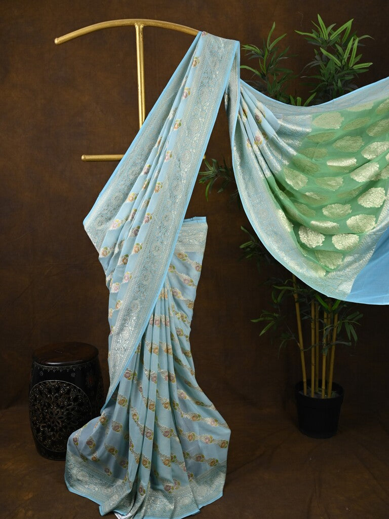 Pure georgette fancy saree light blue color allover zari motifs & zari border with rich pallu and plain blouse
