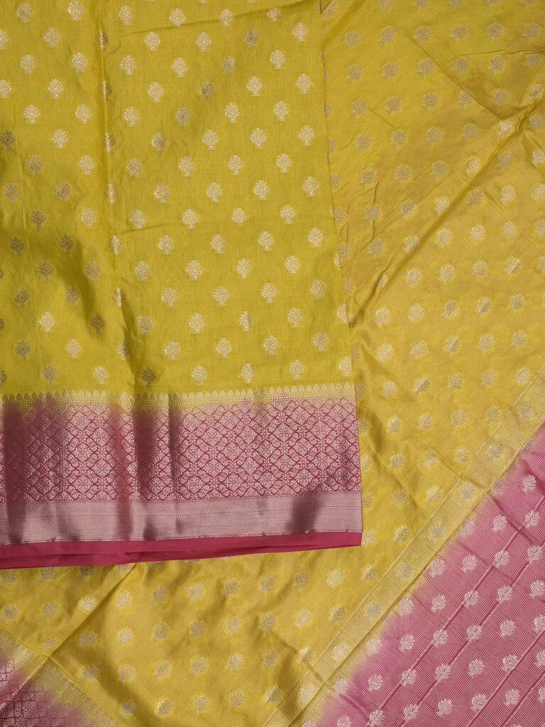 Dupion fancy saree in lemon yellow color allover zari motifs & zari border with zari pallu and contrast blouse