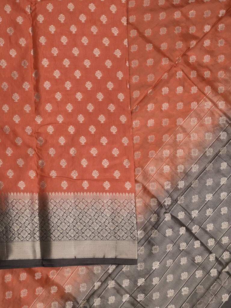 Dupion fancy saree in rust orange color allover zari motifs & zari border with zari pallu and contrast blouse