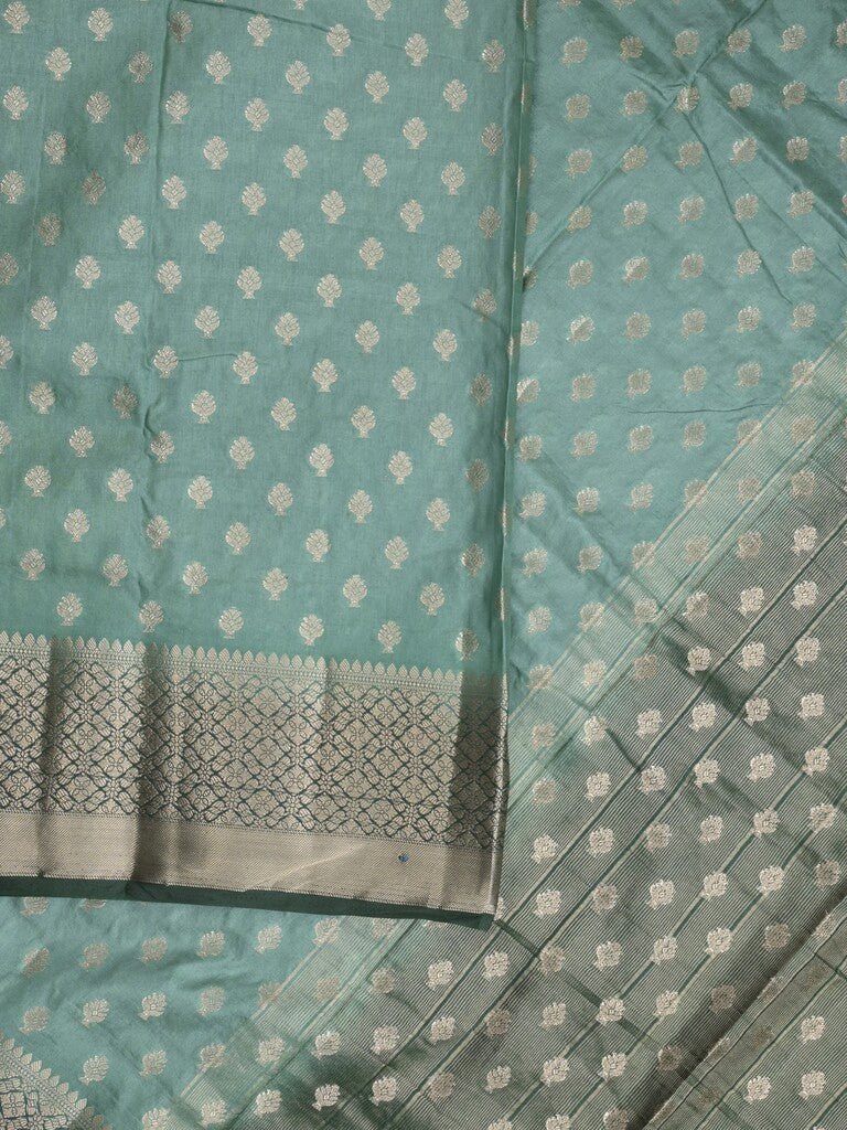Dupion fancy saree in lux green color allover zari motifs & zari border with zari pallu and contrast blouse