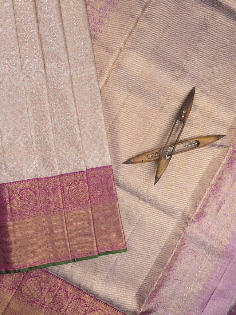 Traditional bridal kanchi tissue pattu saree in cream color with allover rich zari weaves