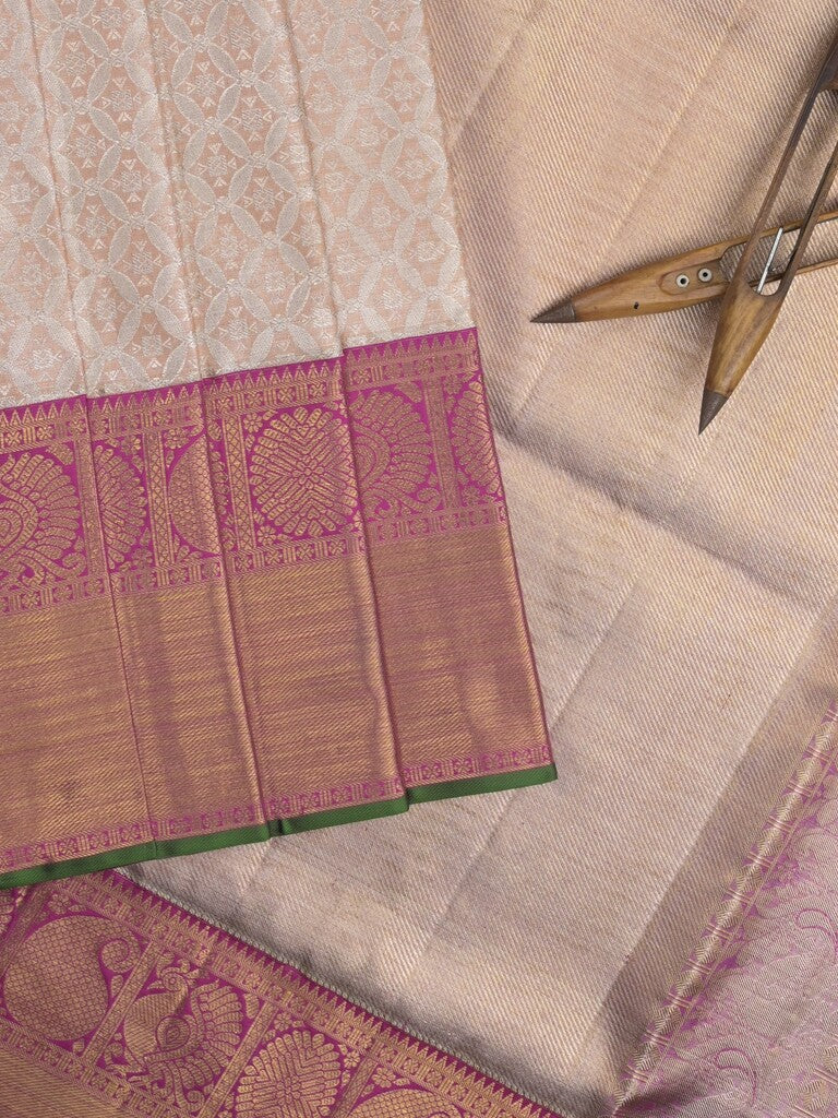 Traditional bridal kanchi tissue pattu saree in cream color with allover rich zari weaves
