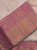 Traditional bridal kanchi tissue pattu saree in cream color with allover rich zari weaves