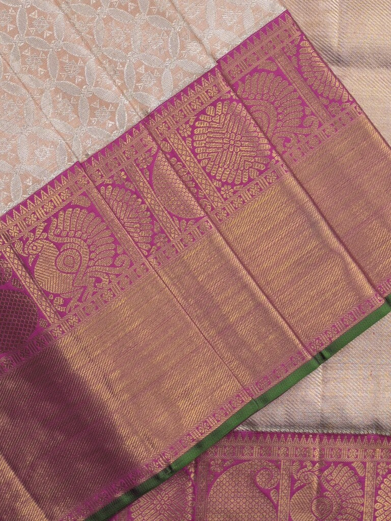 Traditional bridal kanchi tissue pattu saree in cream color with allover rich zari weaves