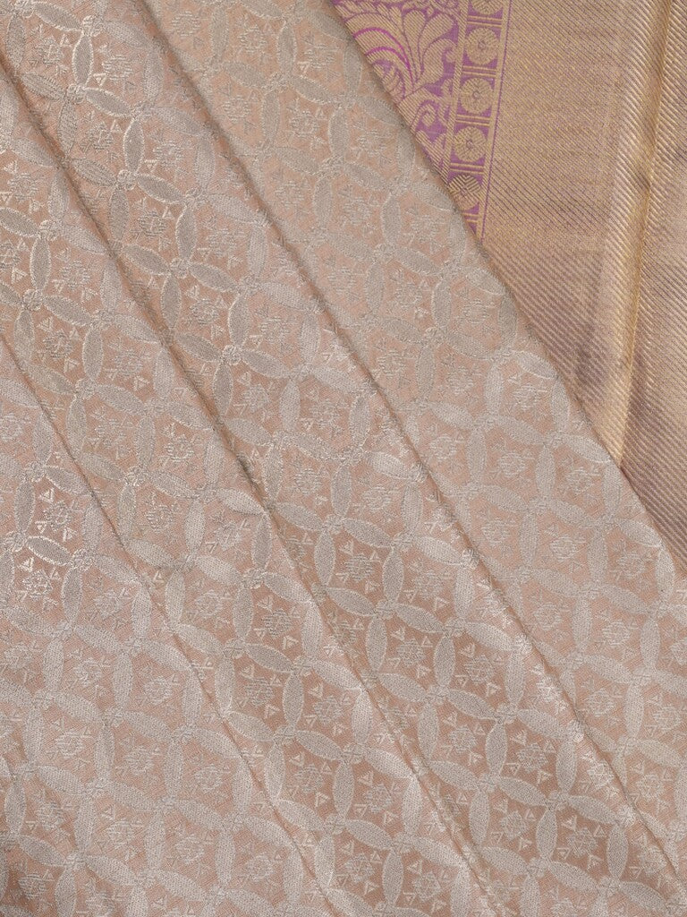 Traditional bridal kanchi tissue pattu saree in cream color with allover rich zari weaves