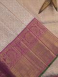 Traditional bridal kanchi tissue pattu saree in cream color with allover rich zari weaves