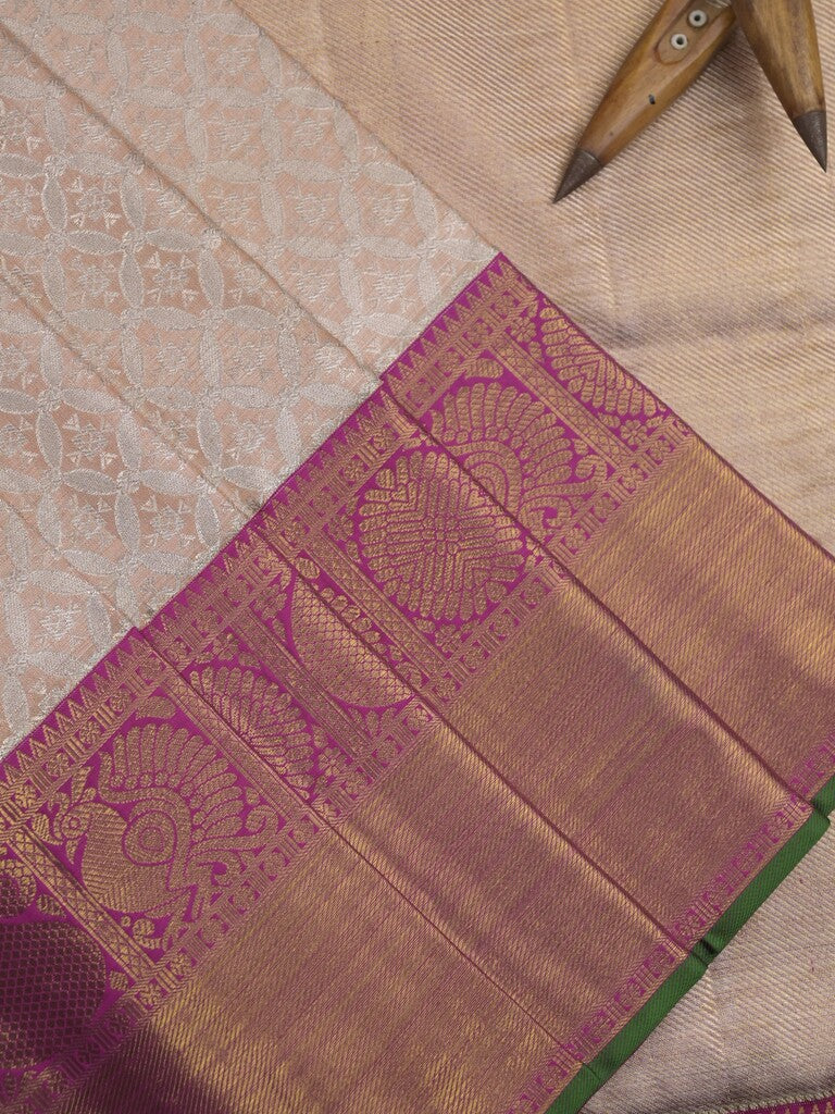 Traditional bridal kanchi tissue pattu saree in cream color with allover rich zari weaves