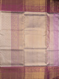 Traditional bridal kanchi tissue pattu saree in cream color with allover rich zari weaves