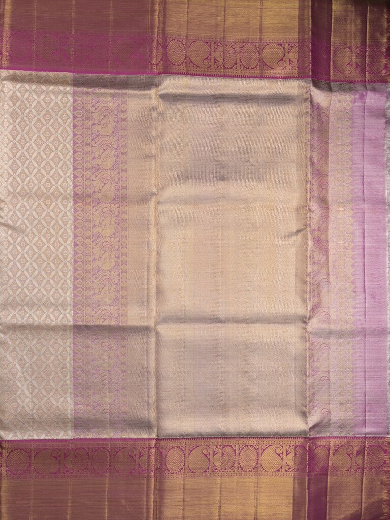 Traditional bridal kanchi tissue pattu saree in cream color with allover rich zari weaves