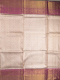 Traditional bridal kanchi tissue pattu saree in cream color with allover rich zari weaves