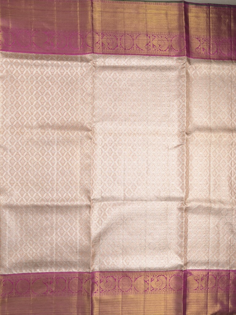 Traditional bridal kanchi tissue pattu saree in cream color with allover rich zari weaves