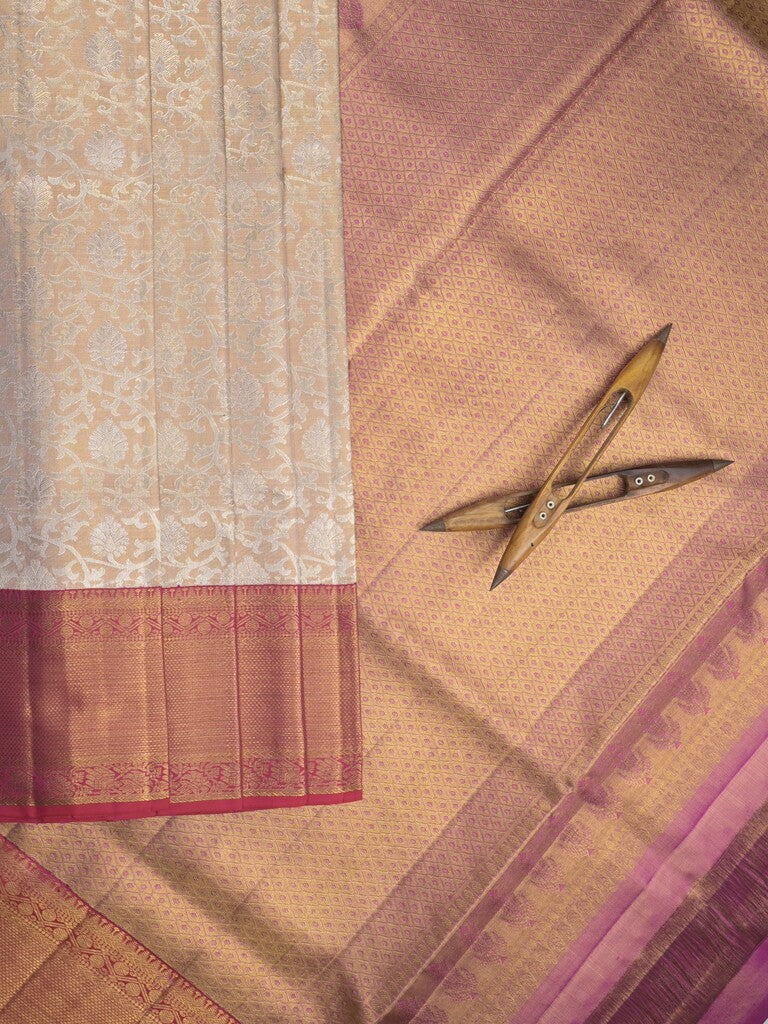 Traditional bridal kanchi tissue pattu saree in cream color with allover rich zari weaves