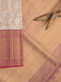 Traditional bridal kanchi tissue pattu saree in cream color with allover rich zari weaves