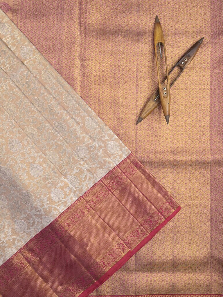 Traditional bridal kanchi tissue pattu saree in cream color with allover rich zari weaves