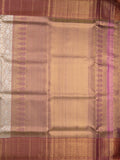 Traditional bridal kanchi tissue pattu saree in cream color with allover rich zari weaves