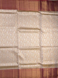 Traditional bridal kanchi tissue pattu saree in cream color with allover rich zari weaves