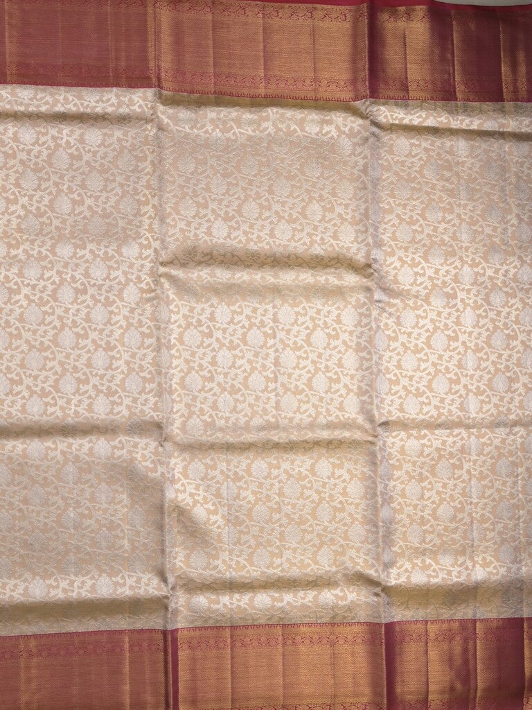 Traditional bridal kanchi tissue pattu saree in cream color with allover rich zari weaves