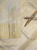 Traditional bridal kanchi tissue pattu saree in cream color with allover rich zari weaves