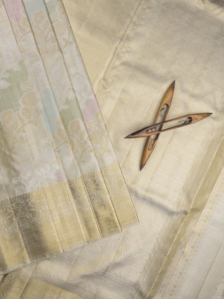 Traditional bridal kanchi tissue pattu saree in cream color with allover rich zari weaves