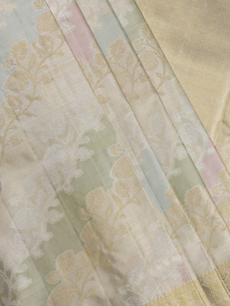 Traditional bridal kanchi tissue pattu saree in cream color with allover rich zari weaves