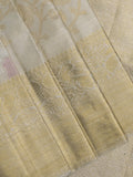 Traditional bridal kanchi tissue pattu saree in cream color with allover rich zari weaves
