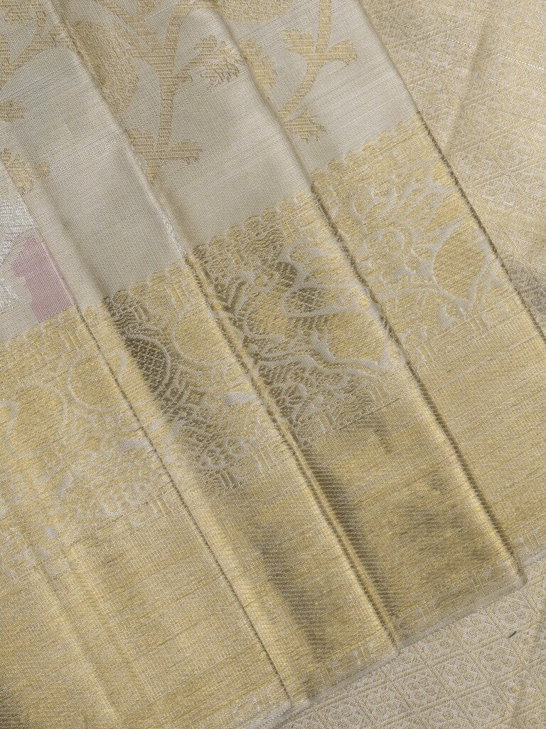 Traditional bridal kanchi tissue pattu saree in cream color with allover rich zari weaves