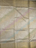 Traditional bridal kanchi tissue pattu saree in cream color with allover rich zari weaves