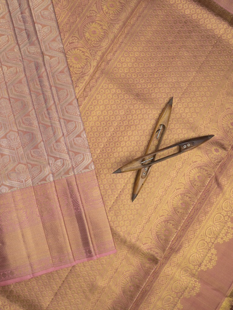 Traditional bridal kanchi tissue pattu saree in peach color with allover rich zari weaves