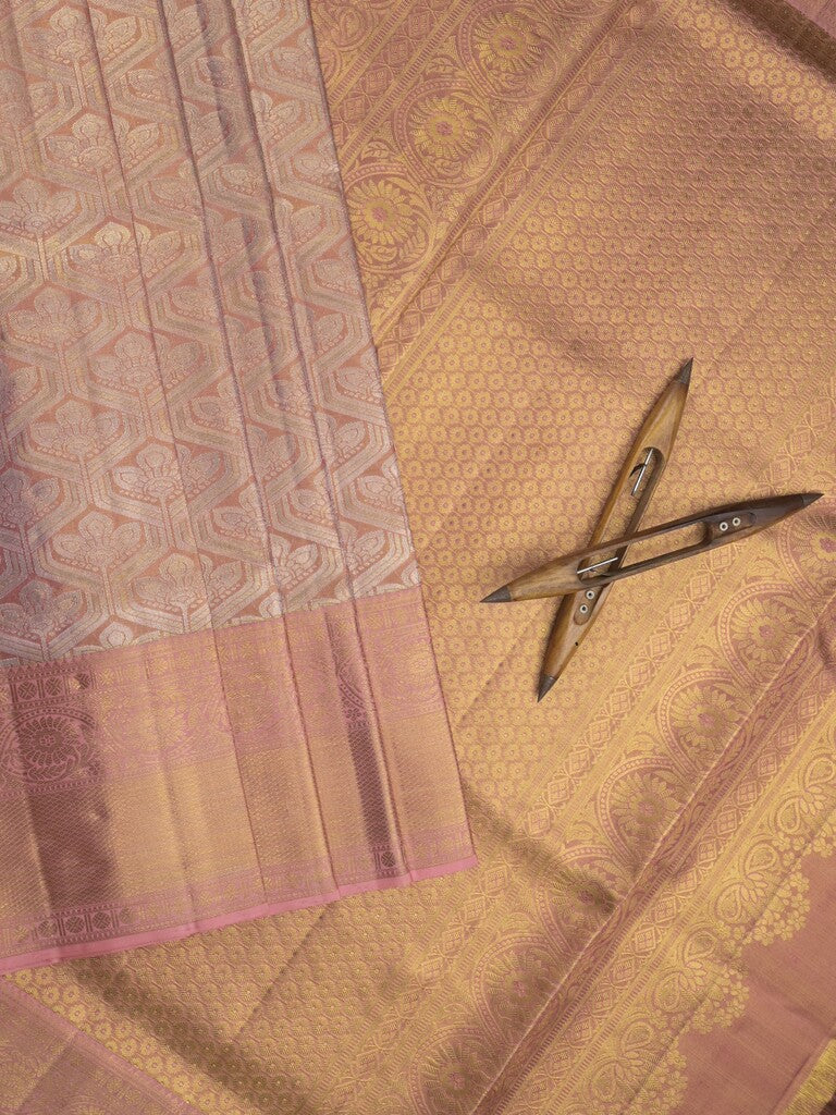 Traditional bridal kanchi tissue pattu saree in peach color with allover rich zari weaves