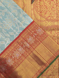 Traditional bridal kanchi tissue pattu saree in blue color with allover rich zari weaves