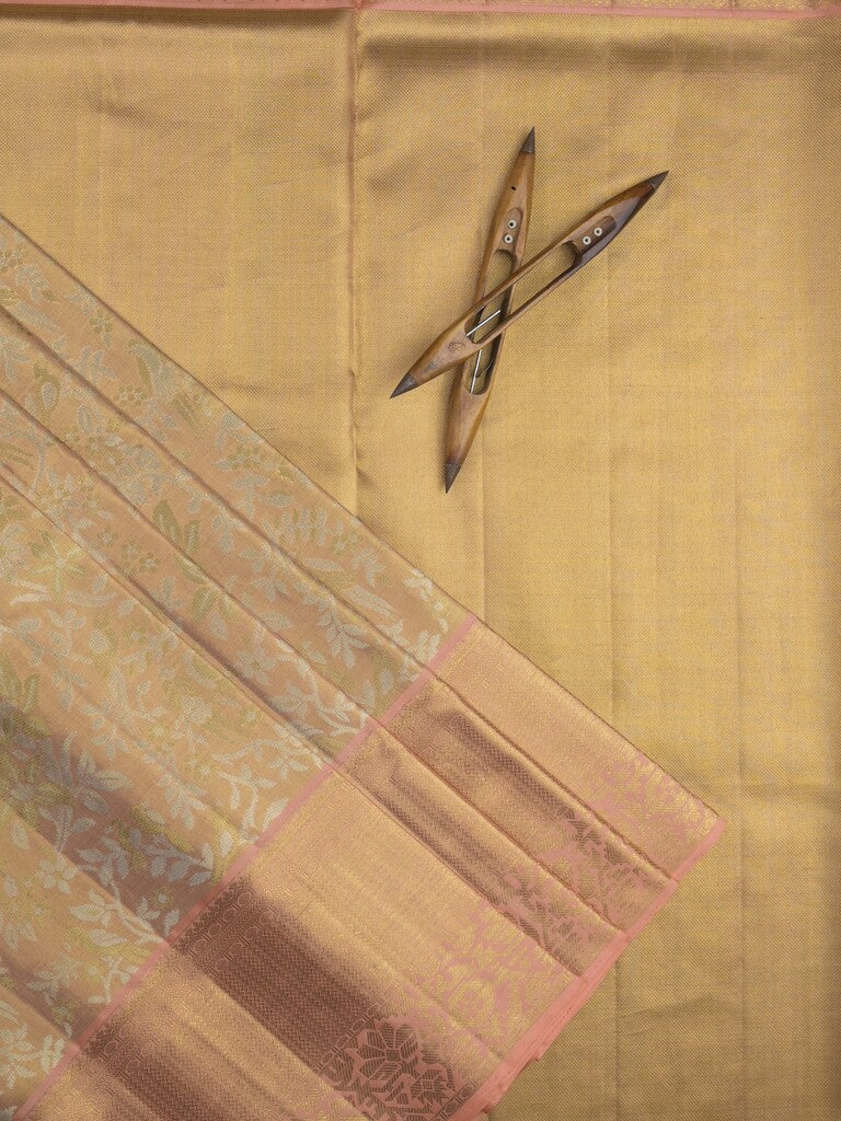Traditional bridal kanchi tissue pattu saree in beige color with allover rich zari weaves