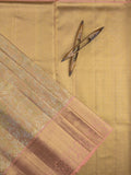 Traditional bridal kanchi tissue pattu saree in beige color with allover rich zari weaves
