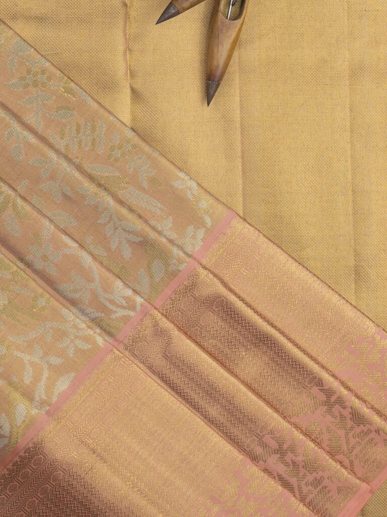 Traditional bridal kanchi tissue pattu saree in beige color with allover rich zari weaves