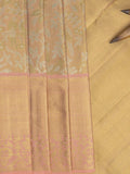 Traditional bridal kanchi tissue pattu saree in beige color with allover rich zari weaves